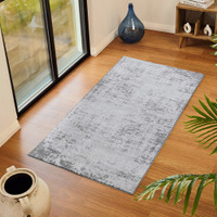 grey abstract rug in a room with matching decor