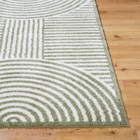 green geometric shaggy rug closeup corner on wood floor