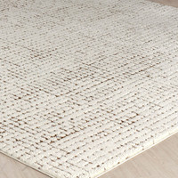 ivory brown scandi rug closeup corner on wood floor