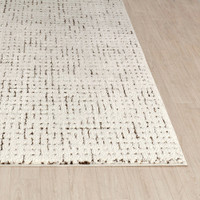 ivory brown scandi rug closeup corner on wood floor