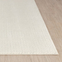 ivory off-white scandi rug closeup corner on wood floor