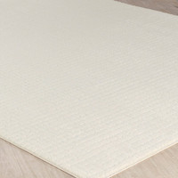 ivory off-white scandi rug closeup corner on wood floor