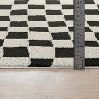 ivory black scandi rug pile height on wood floor
