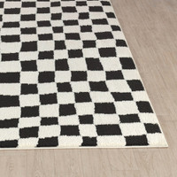 ivory black scandi rug closeup corner on wood floor
