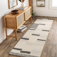 beige striped wool rug in a room with matching decor