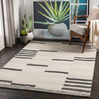 beige striped wool rug in a room with matching decor