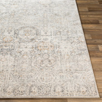 ivory traditional rug closeup corner on wood floor