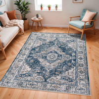 blue traditional rug in a room with matching decor