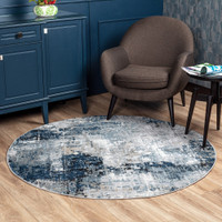 blue abstract rug in a room with matching decor