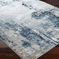 blue abstract rug closeup corner on wood floor