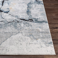 blue abstract rug closeup corner on wood floor