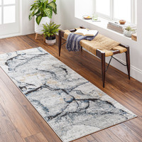 blue abstract rug in a room with matching decor