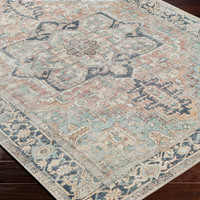 sage traditional rug closeup corner on wood floor