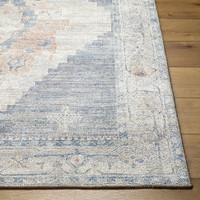 navy traditional rug closeup corner on wood floor