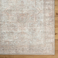 blush  traditional rug closeup corner on wood floor