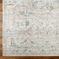 cream traditional rug closeup corner on wood floor