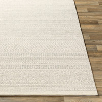 grey tribal wool rug closeup corner on wood floor