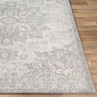 grey traditional rug closeup corner on wood floor