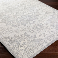 grey traditional rug closeup corner on wood floor