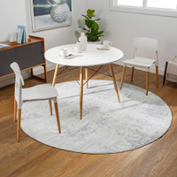 grey abstract rug in a room with matching decor