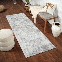 grey abstract rug in a room with matching decor