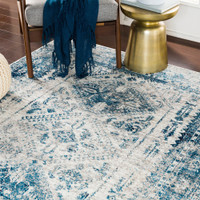 grey abstract rug in a room with matching decor