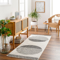 mono geometric rug in a room with matching decor
