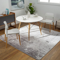 silver abstract rug in a room with matching decor