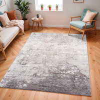 silver abstract rug in a room with matching decor