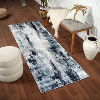 navy abstract rug in a room with matching decor