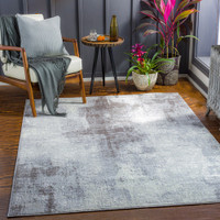 cream abstract rug in a room with matching decor