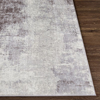 cream abstract rug closeup corner on wood floor