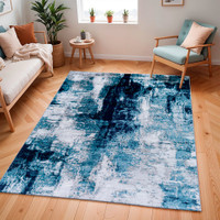 teal abstract rug in a room with matching decor
