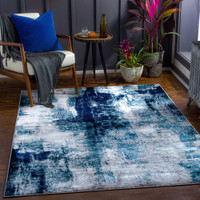 teal abstract rug in a room with matching decor