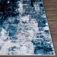 teal abstract rug closeup corner on wood floor