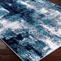 teal abstract rug closeup corner on wood floor