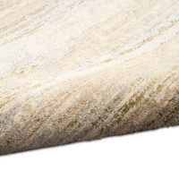 sand calvin klein rug partially rolled on white floor