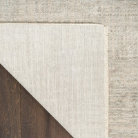 grey abstract rug closeup folded on white background