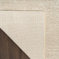 ivory beige abstract rug closeup folded on white background
