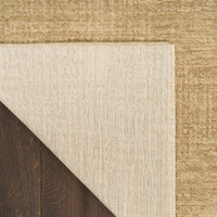 taupe abstract rug closeup folded on white background