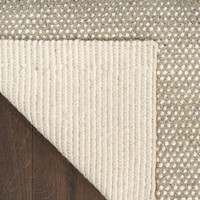 ivory grey rug closeup folded on white background