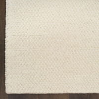 ivory rug closeup corner on wood floor