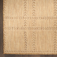 natural geometric indoor outdoor rug closeup corner on wood floor