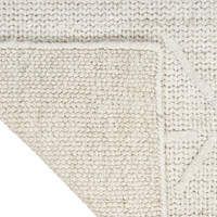grey ivory calvin klein rug corner fold on white background