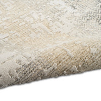 cream ivory calvin klein rug partially rolled on white floor