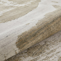 ivory mink abstract rug closeup partially rolled