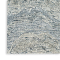 blue abstract rug closeup corner on white floor