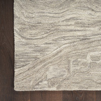 grey abstract rug closeup corner on wood floor