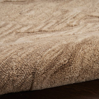 taupe abstract rug closeup partially rolled