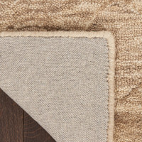 taupe abstract rug closeup folded on white background